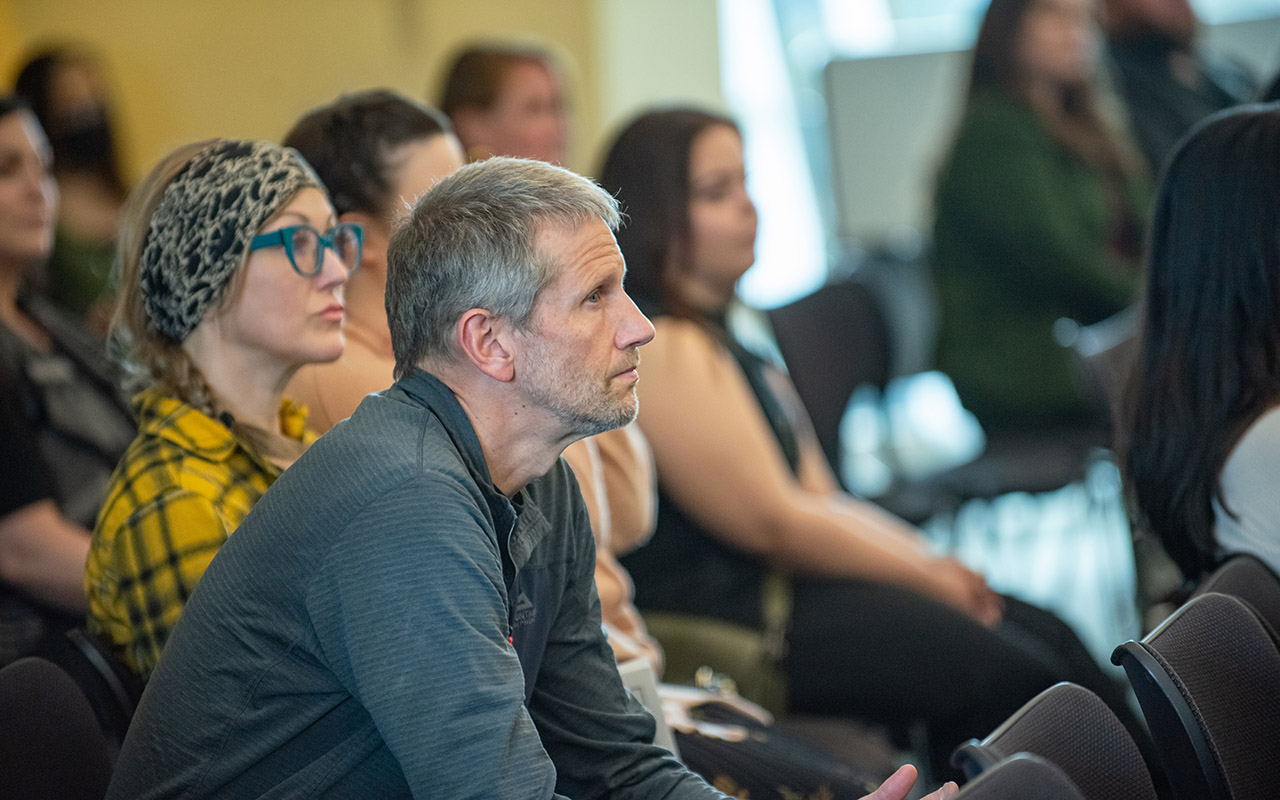 faculty listening to a presentation